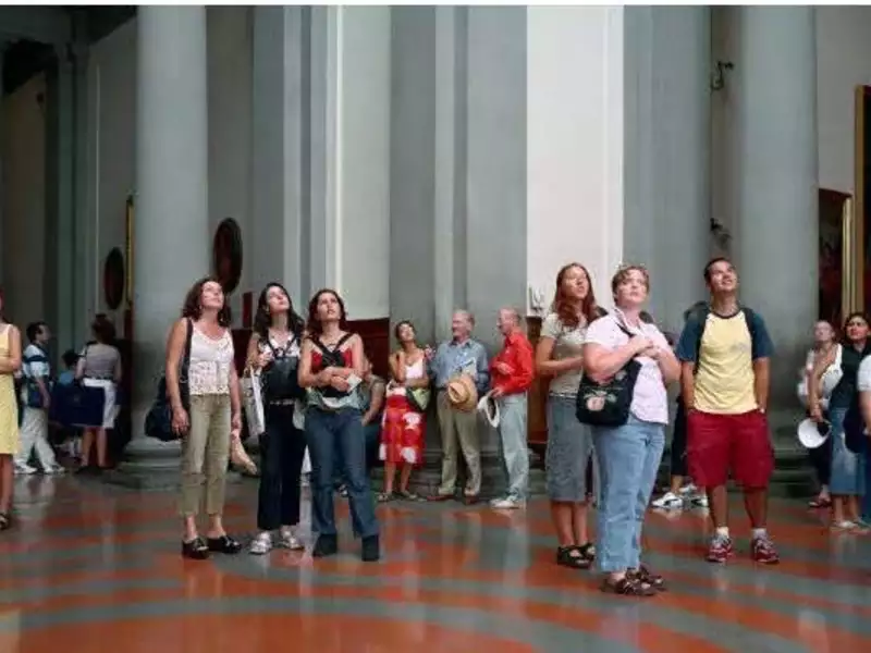 people looking up in a museum
